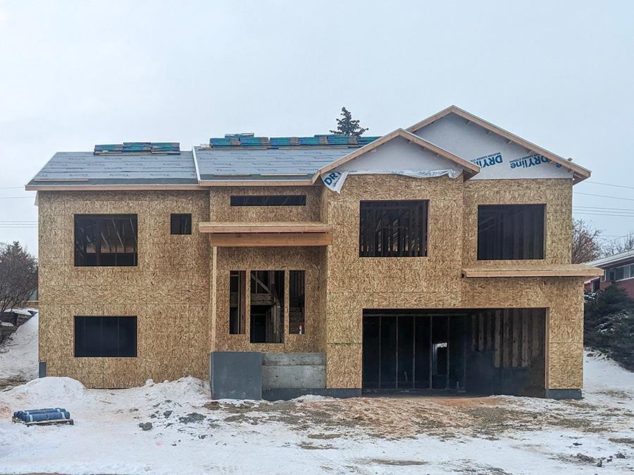 How it's going - Work in Progress Photo of the front of 311 Hillcrest in framing stage.